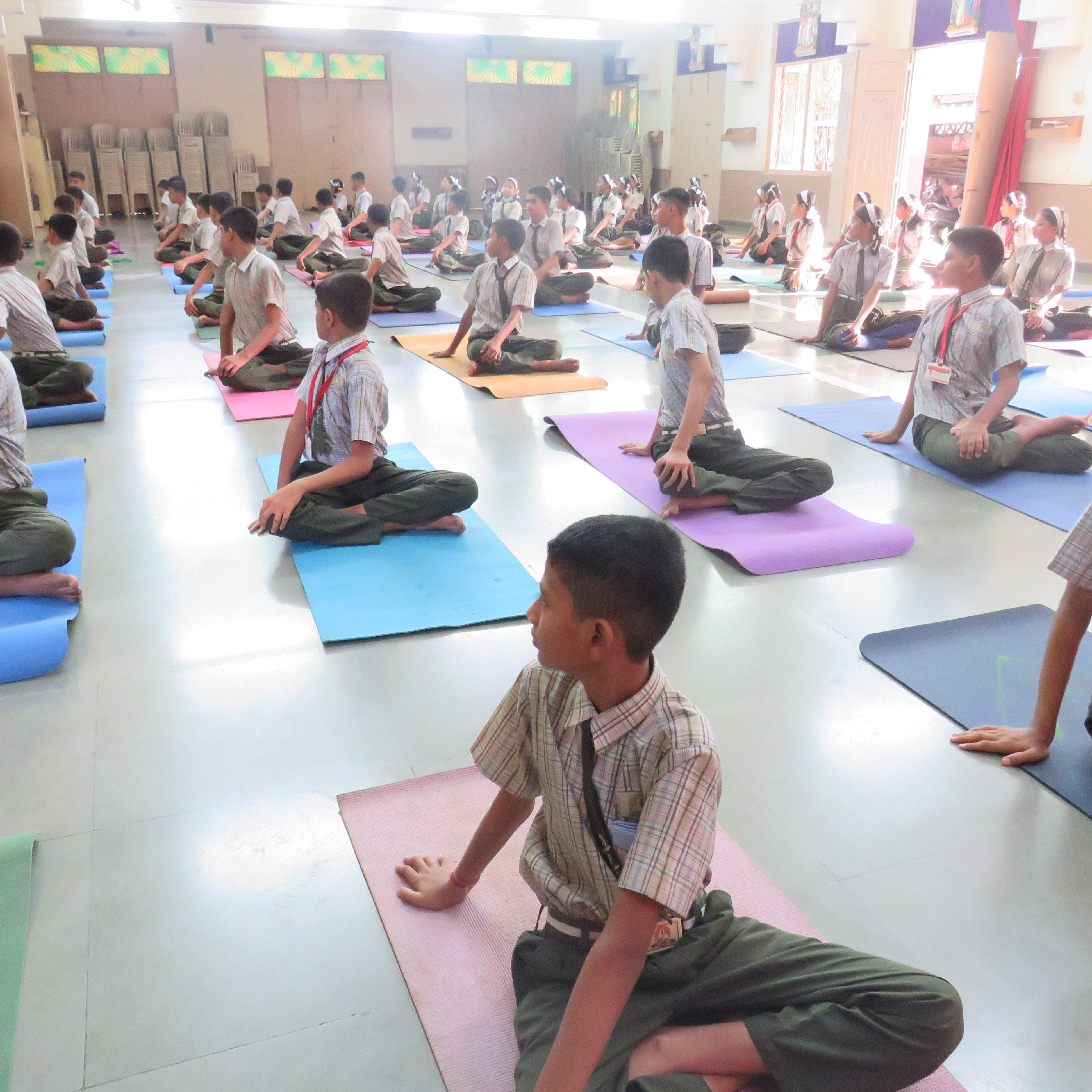 Students doing forward bend stretches